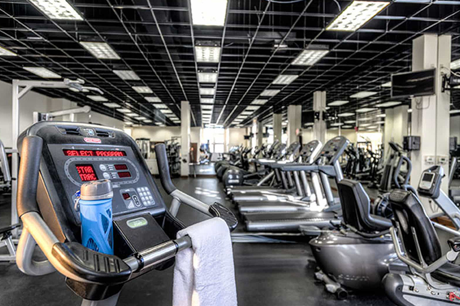 8,000 sq. ft. fitness center with cardio equipment and free weights at The Towers at Wyncote apartments for rent